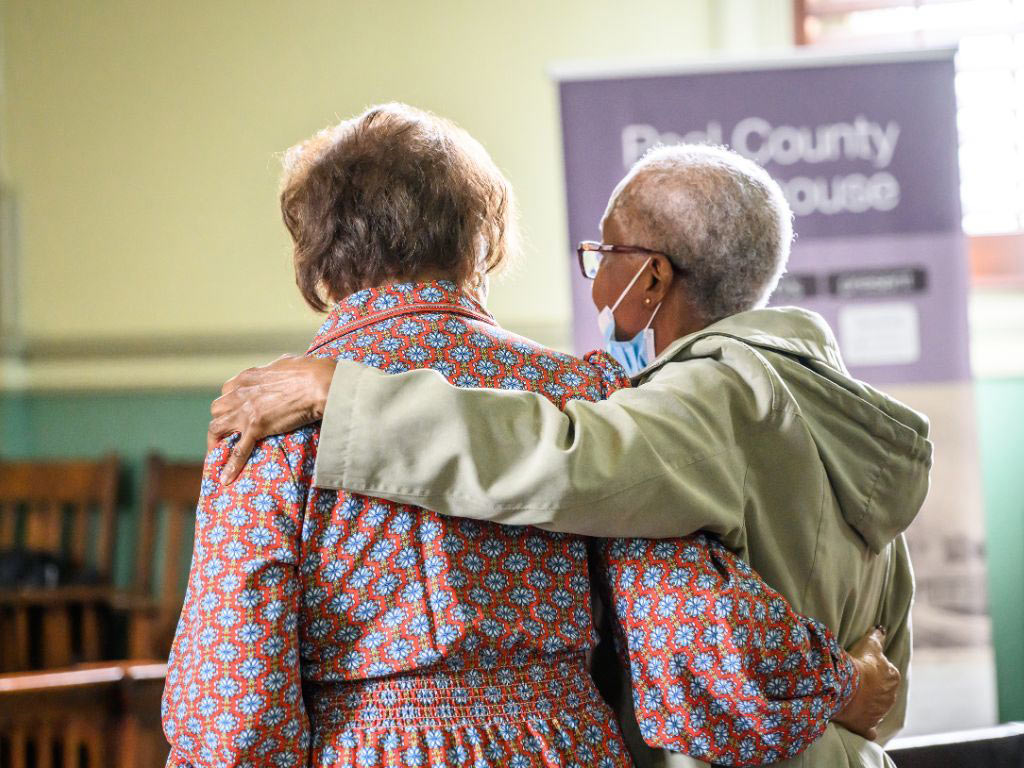 mature black couple walking and holding each other