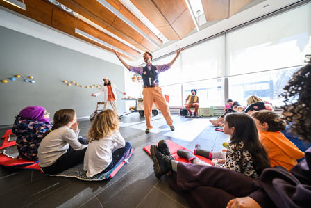 children watching a performance show