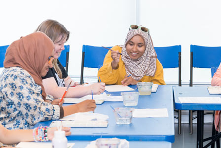 adults participating in painting workshop