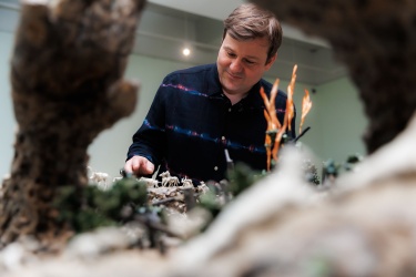 Man interacting with a PAMA exhibit
