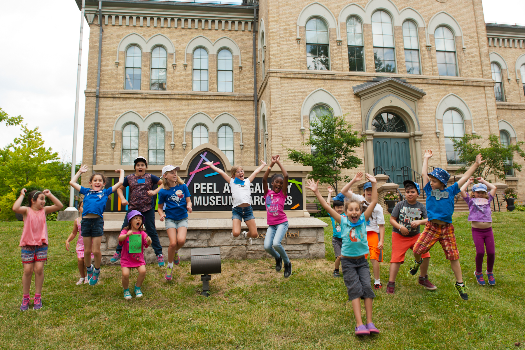 Children jumping on a PAMA lawn.