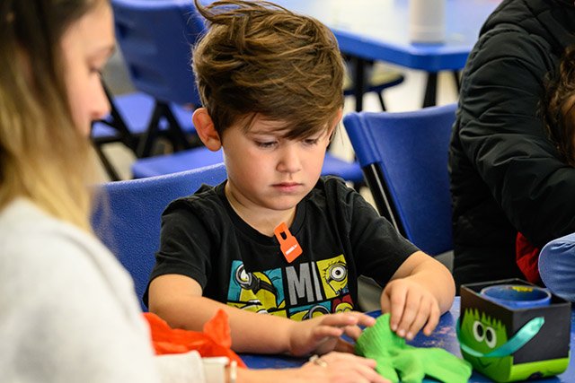 A small boy crafting