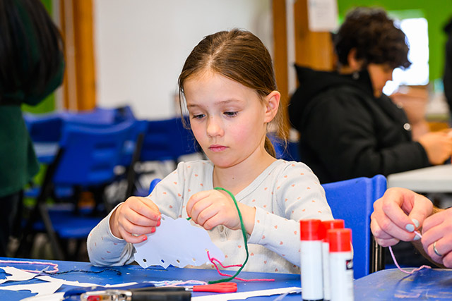 A small girl crafting