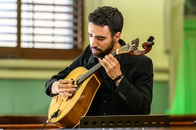 man playing a Celtic mandolin