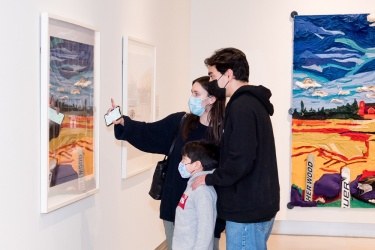 Family looking at art